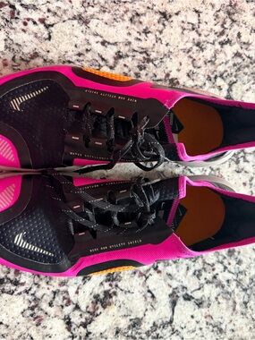 Nike free RN 5.0 shield running in Fire Pink and Black